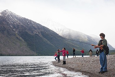 <p>Patrick Cote/Daily Inter Lake Somers School students fish along the shore of Lake McDonald Friday morning in Glacier National Park. The eighth-graders are studying the book "A River Runs Through It" as part of there science and history curriculum. Friday, May 25, 2012 in Glacier National Park, Montana.</p>