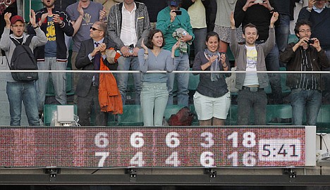 &lt;p&gt;Spectators applauds after the second round match between France's Paul-Henri Mathieu and the USA's John Isner at the French Open on Thursday in Paris. Mathieu won 6-7, 6-4,6-4, 3-6, 18-16.&lt;/p&gt;