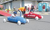 Children race cars in Soap Lake