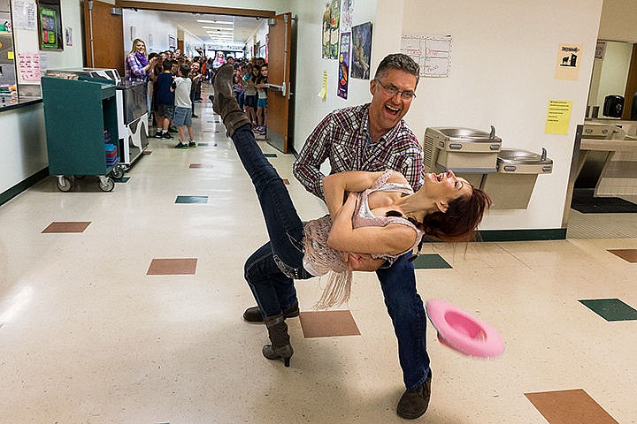 &lt;p&gt;Steve Somers, a fourth grade teacher at West Ridge Elementary, dips resource paraprofessional Danielle Frame while square dancing Wednesday during the judging process of the 205 K-5 School Food Drive Challenge Spirit Award at the Post Falls school. Staff and students adopted a wild west theme for their food donation effort to benefit the Post Falls Food Bank.&lt;/p&gt;