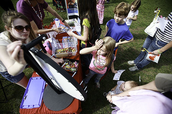 &lt;p&gt;Madison Gaylord, 6, shields her eyes from the sun as she looks to see the results of the spinning wheel she spun for a prize Wednesday at the Spring Fling event at Borah Elementary School.&lt;/p&gt;