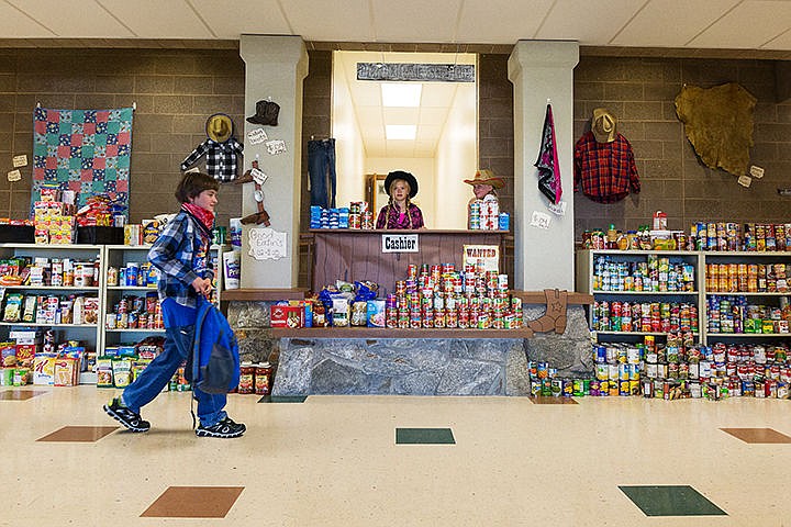 &lt;p&gt;Cashiers of the &#147;General Store&#148; Ashley Haines, in pink, and McKenna Harris, right, both fifth-graders, take their position as other students prepare for the judges of the food drive spirit contest to arrive. West Ridge Elementary won the competition, going up against Seltice, Mullan Trail and Prairie View elementary schools.&lt;/p&gt;