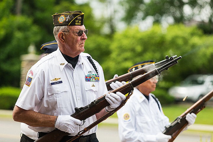 &lt;p&gt;Carl Gidlund, a member of Veterans of Foreign Wars Post 889 and the color guard, fires a weapon during a rifle salute at Hayden City Hall.&lt;/p&gt;