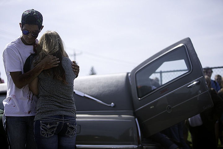 &lt;p&gt;Standing in front of a hearse, Felix Lopez and Mikayla White imitate a reaction to an acted out deceased fellow Lakeland student in the mock driving under the influence demonstration Friday.&lt;/p&gt;