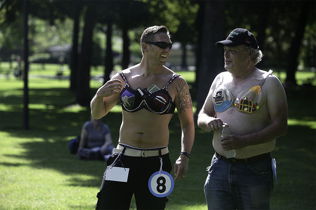 &lt;p&gt;Justin Rader, left, and Ed Hartz walk among the &#147;Bling Out of Spring&#148; spectators and bidders who plan to bid on decorated bras in order to raise money to help distressed veterans and their families at the Coeur d&#146;Alene Fort Sherman Bandshell in City Park Saturday.&lt;/p&gt;