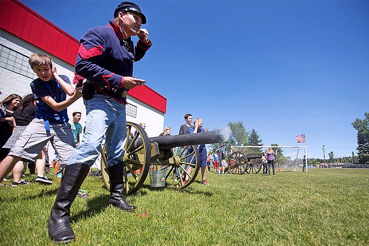 &lt;p&gt;As the final part of the simulation, eighth grade students along with instructor Donald Delcambre steer clear of a baseball fired across the Canfield Middle School field. Students used water balloons and air pressure to shoot targets in the field.&lt;/p&gt;