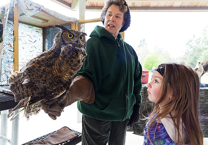 &lt;p&gt;SHAWN GUST/Press&lt;/p&gt;&lt;p&gt;Zoey Becker, 5, of Coeur d&#146;Alene, checks out a great-horned owl held by Beth Paragamian, wildlife education specialist for the Idaho Fish and Game and Bureau of Land Management departments, during Migratory Bird Day Saturday at the Blackwell Island boat launch. The free event, hosted by Coeur d&#146;Alene Audubon and the Bureau of Land Management, included guided bird walks, scavenger hunts, hummingbird feeder projects and several other activities to promote awareness and education about migratory bird species.&lt;/p&gt;