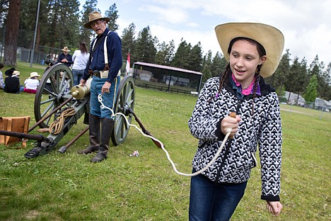 &lt;p&gt;GABE GREEN/Press&lt;/p&gt;&lt;p&gt;Ponderosa Elementary fourth-grader Ashley Hogon pulls the firing mechanism of a 19th century Mountain Howitzer cannon at the annual Pat Triphaun Rendezvous.&lt;/p&gt;