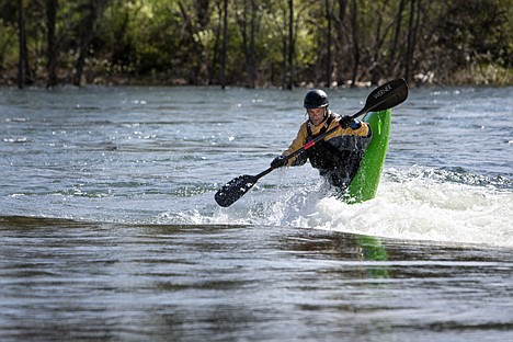 &lt;p&gt;GABE GREEN/Press&lt;/p&gt;&lt;p&gt;Stacy Vanderburg pops out of the water in his kayak while attempting a flip Thursday in the dead dog hole along the Spokane River under the East Appleway Avenue bridge near State Line. Vanderburg has been kayaking for the last four years.&lt;/p&gt;