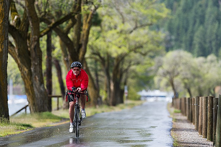 &lt;p&gt;SHAWN GUST/Press&lt;/p&gt;&lt;p&gt;A cyclist makes his way along a wet Centennial Trail Friday during an afternoon ride near Coeur d&#146;Alene Lake Drive.&lt;/p&gt;