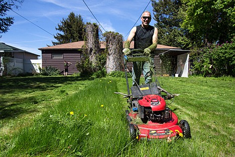 &lt;p&gt;GABE GREEN/Press&lt;/p&gt;&lt;p&gt;Ricky Bacon mows the lawn of Coeur d&#146;Alene resident Polly Newberry Wednesday during the &#147;Rake and Run&#148; volunteering event hosted by CareNet. &#147;I&#146;ve never been so blessed to have such a good group of people come and do this, I just want to cry,&#148; said Newberry.&#160;Volunteers from several different organizations visited the homes of local seniors to assist them with yard work.&lt;/p&gt;