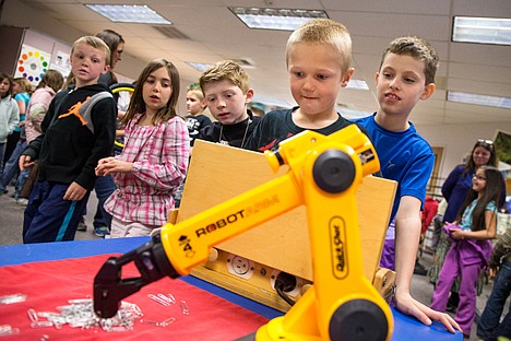 &lt;p&gt;GABE GREEN/Press&lt;/p&gt;&lt;p&gt;Fernan Elementary second-grader Cole Maloney, 7, operates a robot arm to pick up items on &#147;Mars.&#148; Kids at Fernan were able to learn about various aspects of science all day Tuesday from Seattle Pacific Science Center instructors.&lt;/p&gt;