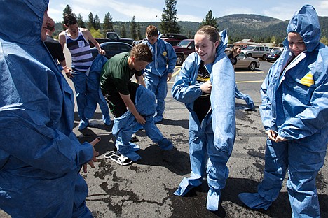 &lt;p&gt;GABE GREEN/Press&lt;/p&gt;&lt;p&gt;Lakeland High School student Angelique Wetherelt puts on a disposable jumpsuit after being &#147;decontaminated&#148; by a deluge from a Norther Lakes firetruck Wednesday during a training exercise. The exercise served as practice for the Norther Lakes Fire Department fro responding to a chemical, biological, radiological, nuclear, and/or explosive hazard.&lt;/p&gt;