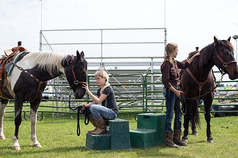 &lt;p&gt;GABE GREEN/Press&lt;/p&gt;&lt;p&gt;Amber Taylor, 10, left, and Alyssa O'Dell, 11, pet a pair of horses in a corral at the Sportsman&#146;s Expo Friday at the Kootenai County fairgrounds where the Bridle Path Brats offered horseback rides.&lt;/p&gt;