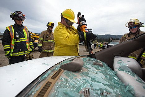 &lt;p&gt;GABE GREEN/Press&lt;/p&gt;&lt;p&gt;Christian Anderson with the North Side and PendOreille fire departments uses a hydraulic cutting tool to sever part of a wrecked car Saturday during a training session led by Troy Speziale of Kootenai County Fire and Rescue on how to dismantle a car when occupied by injured victims. Demonstration cars were donated by Pegasus Auto Recycling in Hayden.&lt;/p&gt;