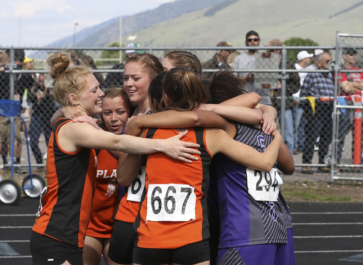 &lt;p&gt;Members of the Charlo and Plains relay teams hug after finishing the 1600-meter relay on Saturday.&lt;/p&gt;&lt;p&gt;&lt;strong&gt;&#160;&lt;/strong&gt;&lt;/p&gt;