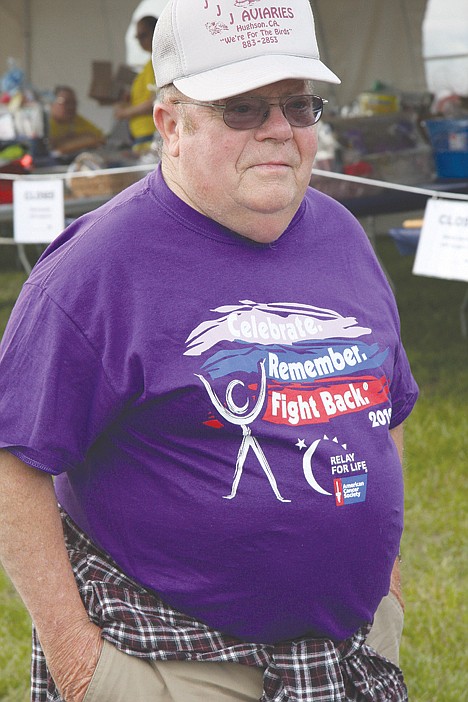 <p>Jim Tate, a cancer survivor, takes a look around at the activities of the Relay for Life on Friday.</p>