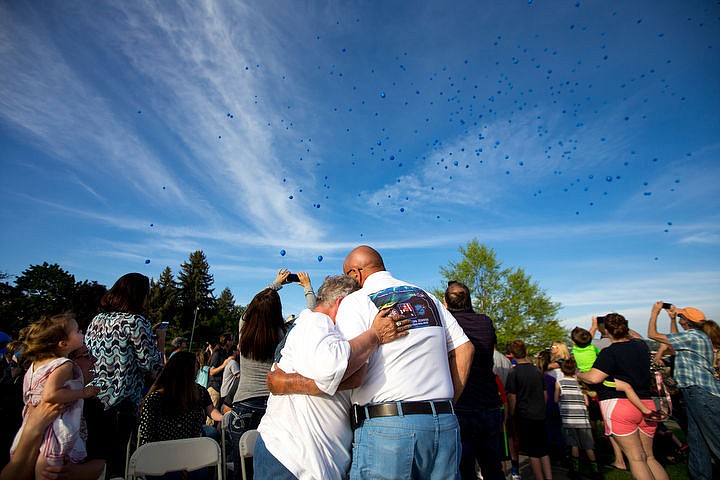 &lt;p&gt;Sherri and Fred Moore, Sgt. Greg Moore's parents, share a moment on Thursday, May 5, 2016 as 200 balloons fill the sky at a memorial ceremony for the fallen police officer at Independence Point.&lt;/p&gt;