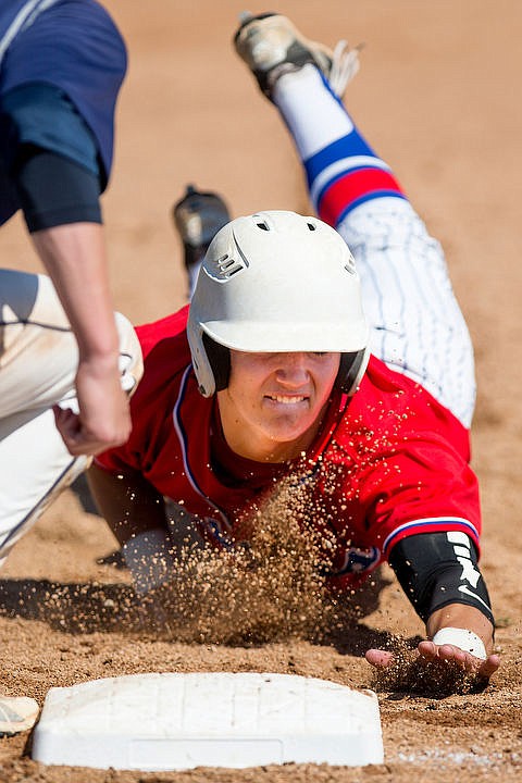 &lt;p&gt;Coeur d'Alene's Nate English dives back to first as Lake City's Dominic Conigliaro picks him off on Tuesday, May 3, 2016 at Coeur d'Alene High School.&lt;/p&gt;