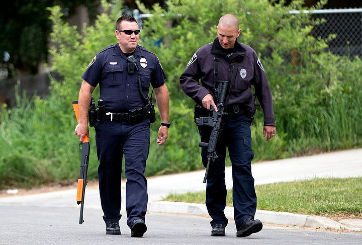 &lt;p&gt;Two Coeur d'Alene Police officers walk down D Street on Thursday, May 19, 2016 at the scene of an assault with a weapon in Coeur d'Alene.&lt;/p&gt;