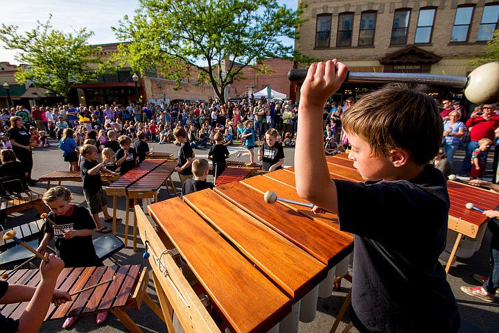 &lt;p&gt;Sorenson Magnet School student Henry Depew, right, plays the marimbas along with the school's marimba group in front of hundreds on Friday, May 13, 2016 on Sherman Avenue. The school's sixth annual Art Walk presentation featured more than 200 students performing a variety of shows as a token of appreciation for Coeur d'Alene's Downtown Association.&lt;/p&gt;