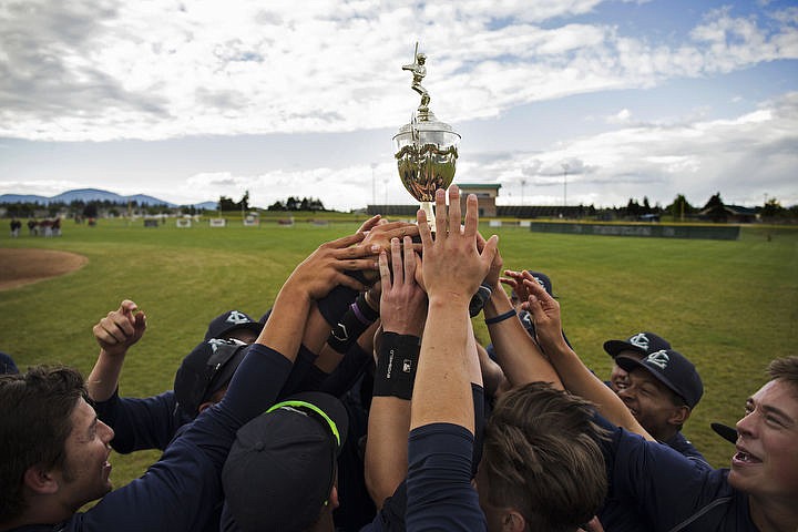 &lt;p&gt;LOREN BENOIT/Press Lake City baseball players touch the Region 1 championship baseball trophy after defeating the No. 4 seed Post Falls Trojans 10-0 on May 10, 2016.&lt;/p&gt;