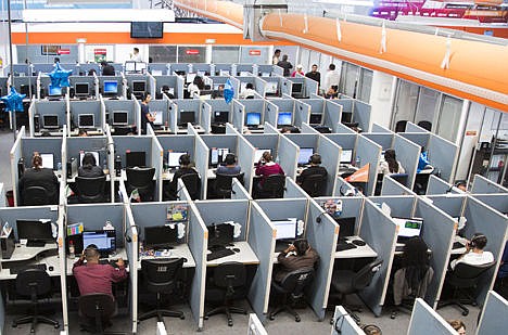 &lt;p&gt;In this Aug. 13, 2014 photo, workers sit at desks at Firstkontact Center, a call center in Tijuana, Mexico. British experts are recommending office workers stand for at least two hours a day, in a warning against the dangers of sitting. The guidelines were published online Monday in the British Journal of Sports Medicine.&#160;&lt;/p&gt;