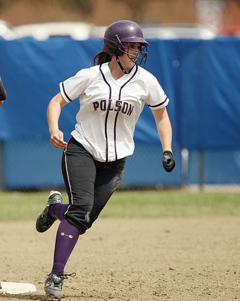 Sallie Sams of Polson runs past Maddie Cebuhar of Laurel on her way to second base during their game at the State A tournament at Stewart Park on Thusday, May 27, 2010. Polson defeated Laurel and will face Billings Central at 9 a.m.