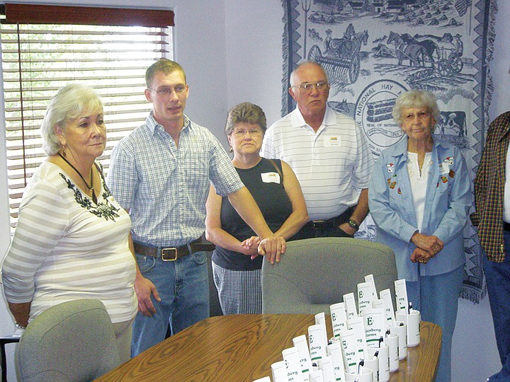 Randy Eckenberg, second from left, describes how his grandfather started Eckenberg Farms. A third generation Eckenberg, Randy manages the farm operation's laboratory. Taking in the presentation, from left, are Virgina Fowler, Cheryl and Mike Wolff and Jeannine Buchanan.