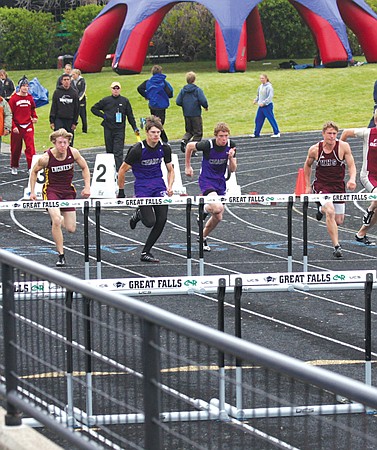 Senior Cody Nitschke and sophomore Stephen Delaney get off to a good start during the 100-meter hurdle race.