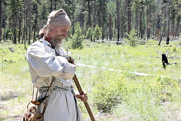 &lt;p&gt;Dressed in authentic clothing from the Revolutionary War era, Dave &quot;Badger Stomper&quot; Sowers, of Colton, Ore., prepares his .62 Caliber smooth-bore rifle.&lt;/p&gt;