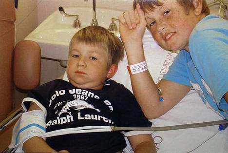 &lt;p&gt;In this 2004 photo provided by the family, Garrett Stringer, 11, right, visits his brother Gatlin, 6, during a chemotherapy session at Houston's M.D. Anderson Cancer Center. Both were successfully treated for acute lymphocytic leukemia, the most common childhood cancer.&lt;/p&gt;