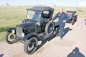<p>Rick Carnegie, who owns a machine shop in Spokane, is shown waiting to flag out for the 2013 Montana 500. ÊHe was instrumental in bringing the event to Libby this year. ÊTen years ago, it was headquartered at Eureka. Photo by Mike Cuffe, president of the Montana Model T Cross Country Touring Association.</p>