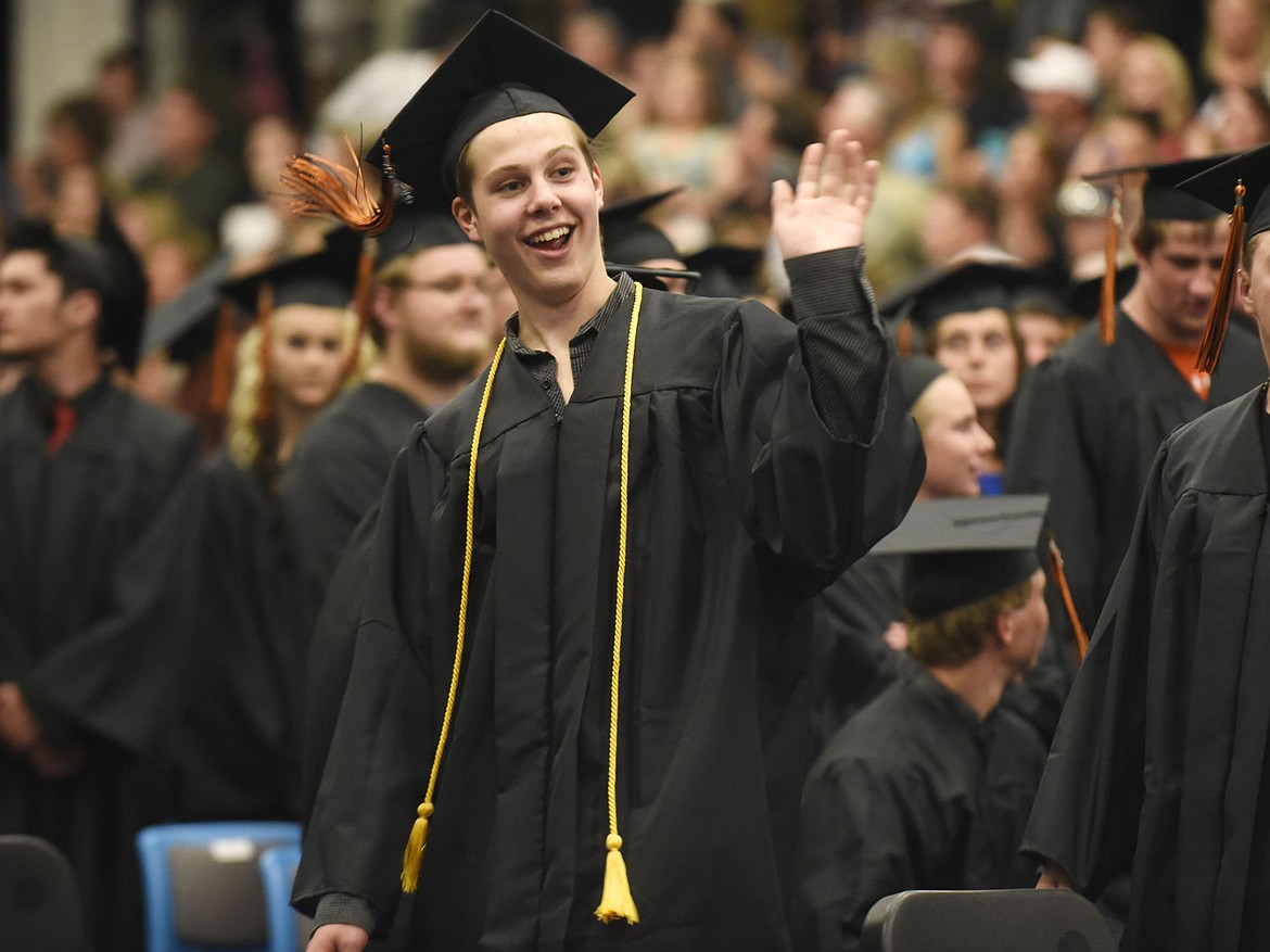 &lt;p&gt;Flathead graduate Escher Kornick waves during the processional of the 118th Commencement Ceremony of Flathead High School on Friday. (Aaric Bryan/Daily Inter Lake)&lt;/p&gt;