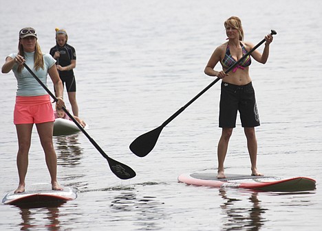 &lt;p&gt;Kym Murdoch, left, owner of Coeur d'Alene Paddleboard, Shadna Ban, and daughters Madison, 12, and Sienna, 5, skim along Lake Coeur d'Alene during a May excursion.&lt;/p&gt;