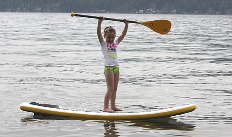 &lt;p&gt;Paris Ban, 7, celebrates a successful ride on a paddleboard with the family.&lt;/p&gt;