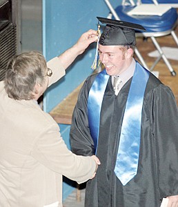 &lt;p&gt;Patrick Faulkner is all smiles as Libby HIgh School counselor Mark Kreuz positions his tassel to the left.&lt;/p&gt;