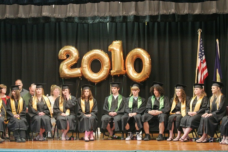 Samantha Davids, Destini Davis, Katie Drobny, Morgan Hill, Shad Hotchkiss, James Jennings, Zach Lott, Briana Managhan, Susan Martin and Heather Pruitt wait to receive their St. Regis High School diplomas.