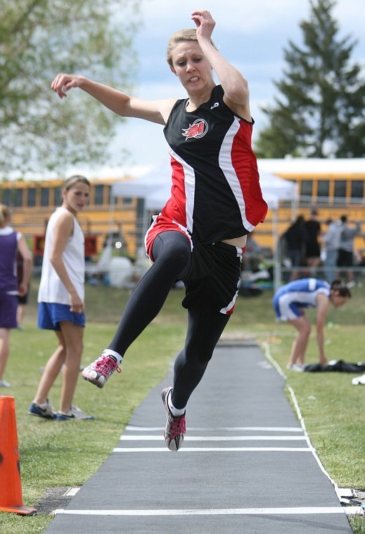 Devon White soars in the long jump at the Divisional track meet in Missoula. Both her and Randi Arnold qualified in that and the triple jump.