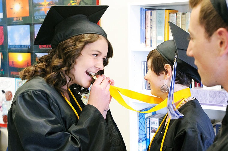 &lt;p&gt;Sarah Smith, left, jokes that it is a gold medal while she bites on the salutatorian medal of Jessica Koch Friday night before Stillwater Christian School&#146;s commencement ceremony.&lt;/p&gt;