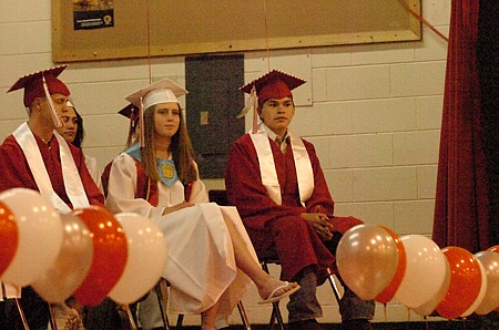 April Burnett and John Sansavere listen to the speeches.