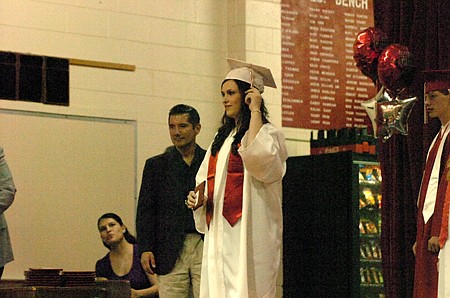 Mychael DIx turns her tassel.