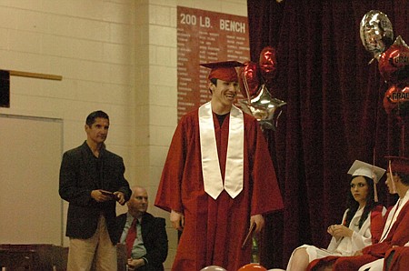 Forest McReynolds smiles after getting his diploma.