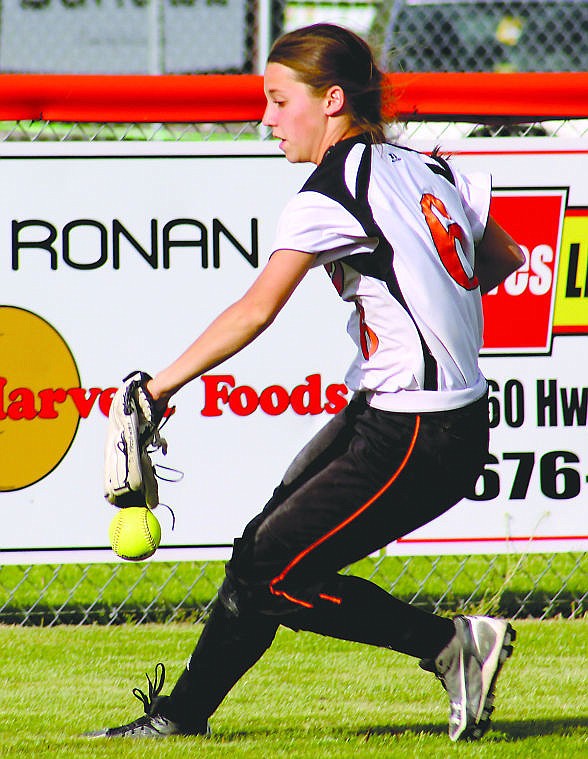 &lt;p&gt;Plains outfielder Diana Woodward corrals a base hit during Friday's Western B/C Divisional softball game with Ronan.&#160;&lt;/p&gt;