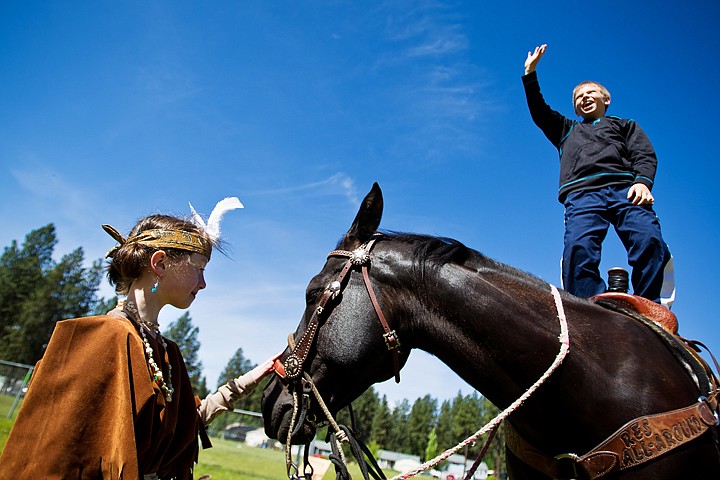 &lt;p&gt;Alison Harris, a fourth-grader at Ponderosa Elementary School in Post Falls, pets Teddy, a horse brought in by school board member, Dave Paul, as Jordan Rice stands and waves before taking a ride Thursday during Ponderosa Rendezvous. Approximately 100 fourth grade student participated in the event that included 10 different stations where students learned about what is was like to live in the American Old West.&lt;/p&gt;