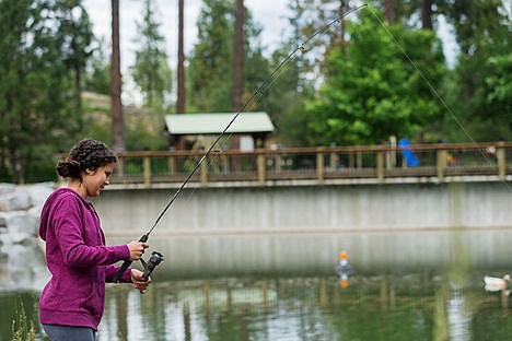 &lt;p&gt;Kayla Leu-Clark, 11, fishes in a pond at Falls Park in Post Falls on Wednesday. To order prints, go to http://cdapress.com/photojournalism.&lt;/p&gt;