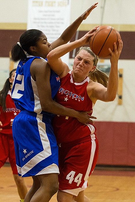 <p>Regions Sydney Williams makes a move toward the basket against Otiona Gildon, with the Metro All-Stars, during the second half.</p>