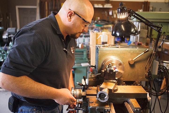 &lt;p&gt;Brandon Miller uses a lathe to prepare a barrel for a muzzle break in his Creston gunsmith shop.&lt;/p&gt;