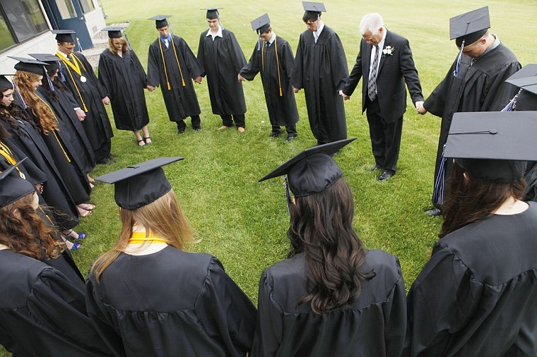 &lt;p&gt;Stillwater Christian School seniors take a moment to pray before the start of graduation Friday night. Friday, June 1, 2012 in Kalispell, Montana.&lt;/p&gt;