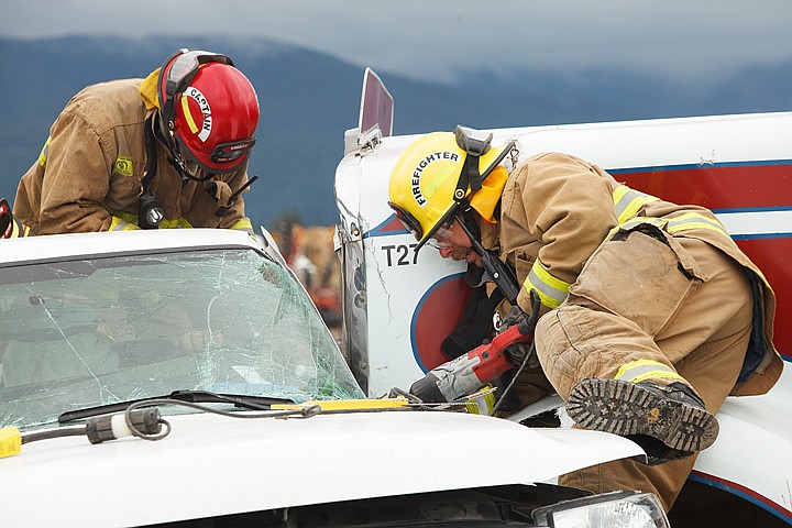 &lt;p&gt;Patrick Cote/Daily Inter Lake Creston figherfighters extricate a man from his pickup truck after being hit by a semi-truck on Egan Slough Road Friday afternoon. Friday, June 1, 2012 in Kalispell, Montana.&lt;/p&gt;